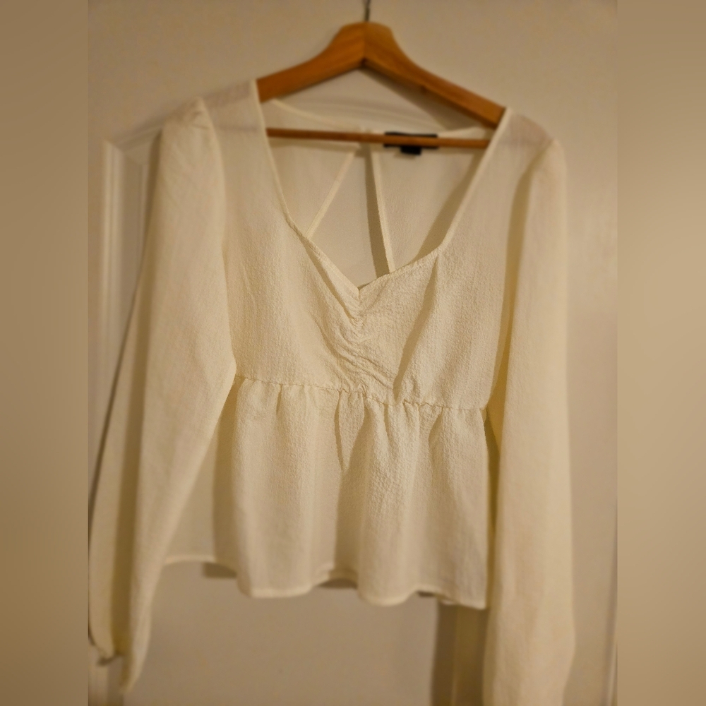 Chic Cream Peplum Blouse with V-Neck and Long Sleeves